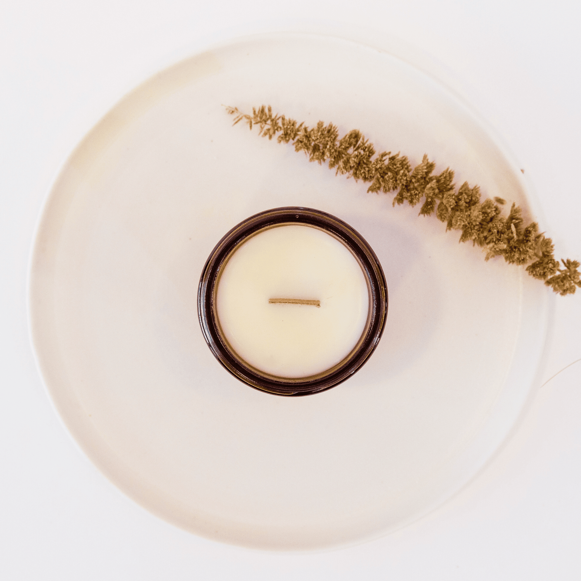 candle on a plate from above